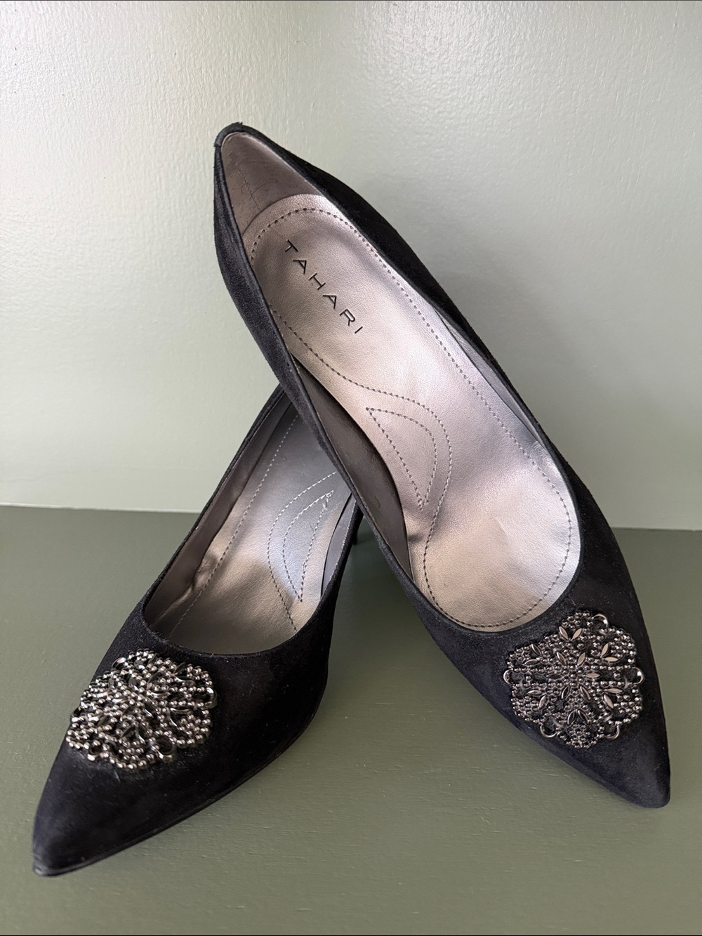 Tahari Black Pointed-Toe Heels with Metallic Brooch Detail